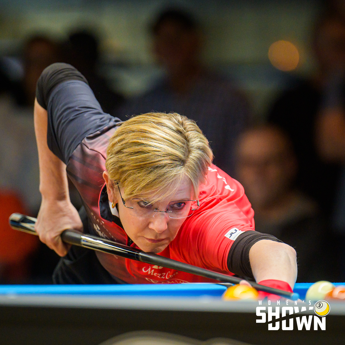Allison Fisher lining up a shot in competition